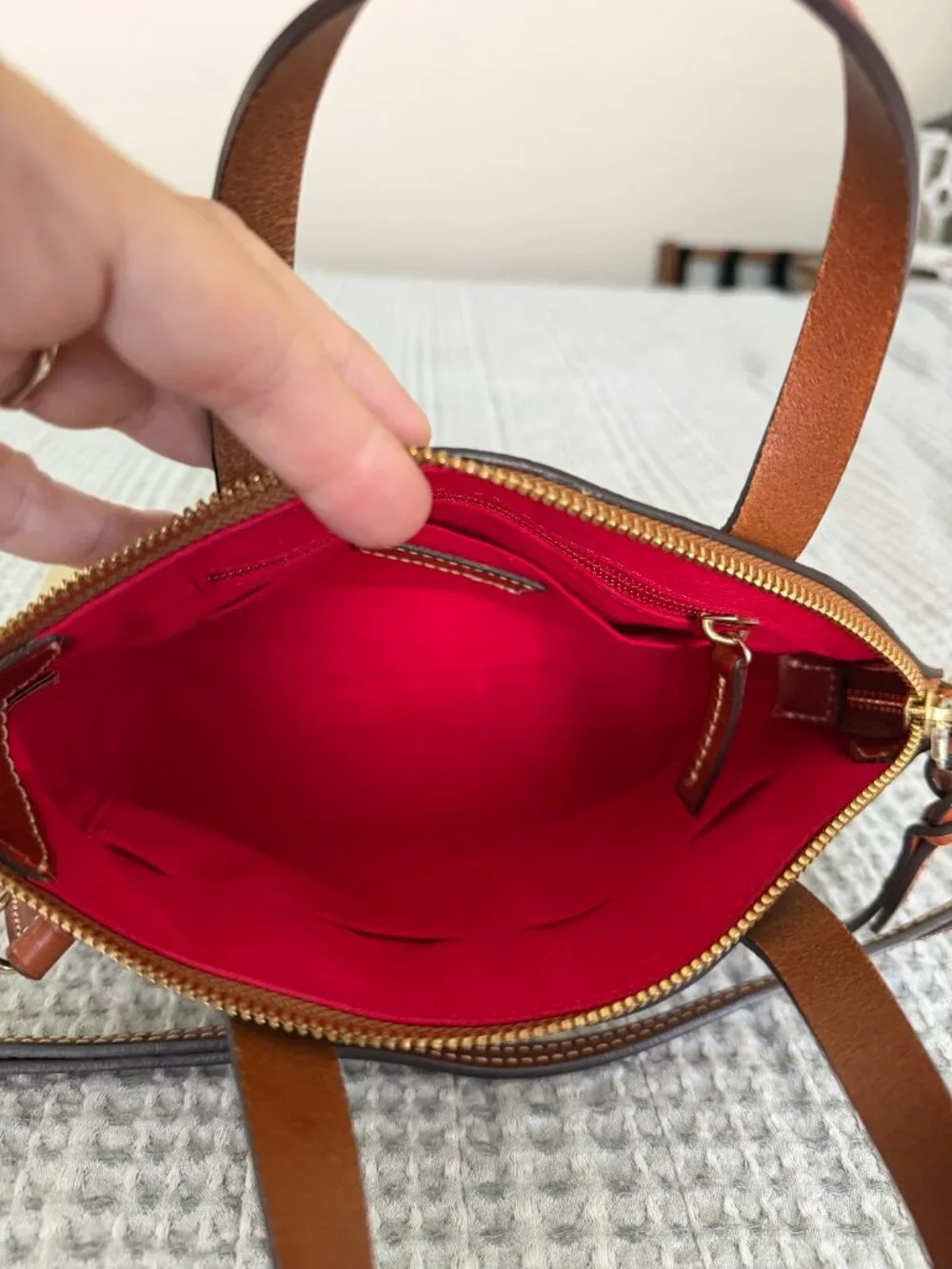 Dooney & Bourke •	zipper closure